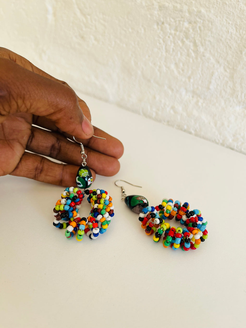 Handmade beaded earrings made with small glass beads and metal hooks