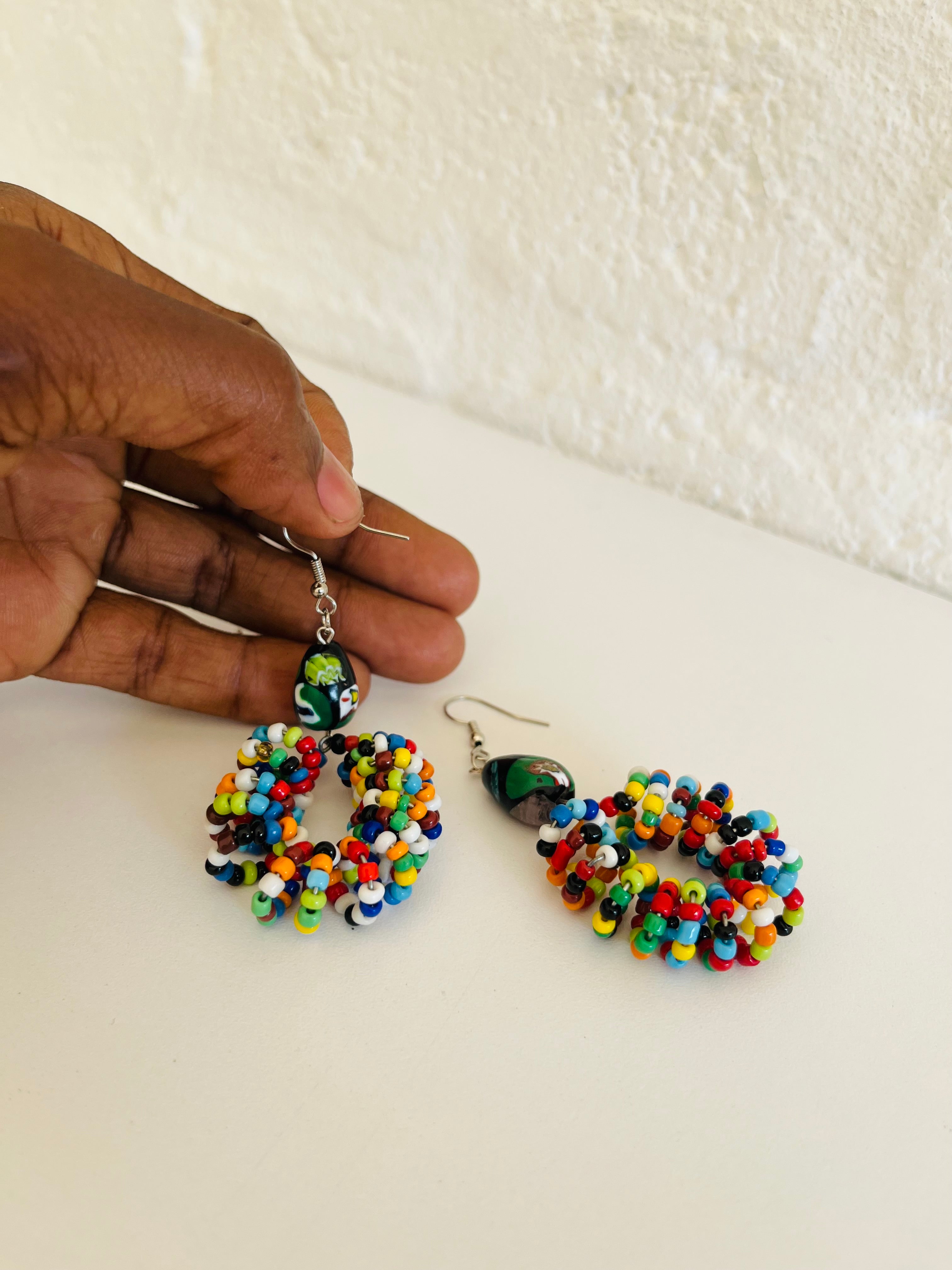 Handmade beaded earrings made with small glass beads and metal hooks